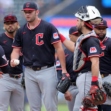 Aug 6, 2025; New York City, New York, USA; Cleveland Guardians manager Stephen Vogt (12) takes the ball from starting pitcher Gavin Williams (32) during a pitching change during the ninth inning against the New York Mets at Citi Field. Mandatory Credit: Brad Penner-Imagn Images