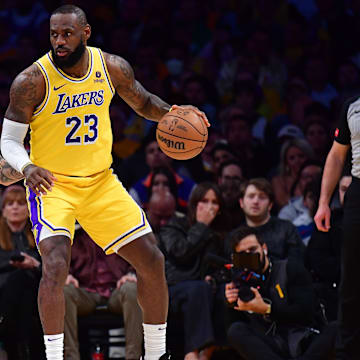 Apr 25, 2024; Los Angeles, California, USA; Los Angeles Lakers forward LeBron James (23) controls the ball against Denver Nuggets forward Michael Porter Jr. (1) during the first half in game three of the first round for the 2024 NBA playoffs at Crypto.com Arena. Mandatory Credit: Gary A. Vasquez-Imagn Images