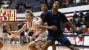 Dalton sophomore Brady Hignight and Richmond Heights sophomore Dorian Jones battle for position for a rebound during the Division IV Regional Final game at the Canton Memorial Fieldhouse, March 10, 2023.

Dalton Bulldogs Vs Richmond Heights Spartans Division Iv Regional Final High School Basketball