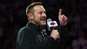 Arkansas Razorbacks new head football coach Ryan Silverfield speaks to the crowd during halftime against the Louisville Cardinals at Bud Walton Arena. 