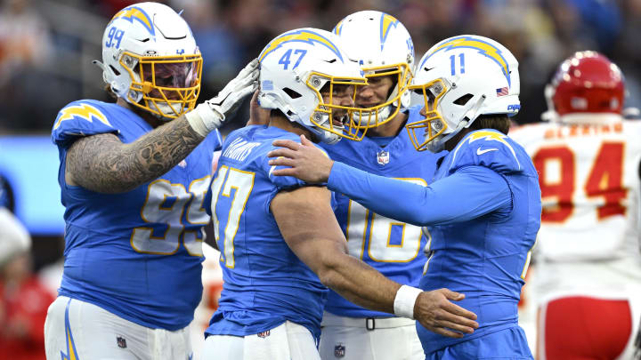 Jan 7, 2024; Inglewood, California, USA; Los Angeles Chargers place kicker Cameron Dicker (11) celebrates with teammates after a field goal against the Kansas City Chiefs during the second half at SoFi Stadium. Mandatory Credit: Orlando Ramirez-USA TODAY Sports