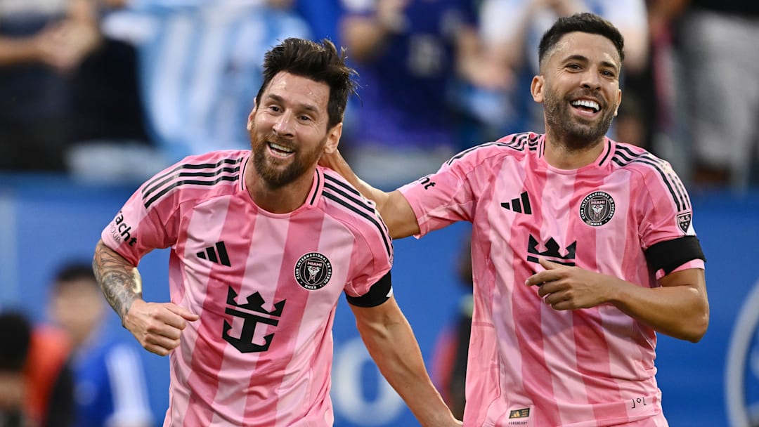 Inter Miami CF players Lionel Messi and Jordi Alba celebrate Saturday after one of Messi's two goals against CF Montreal.
