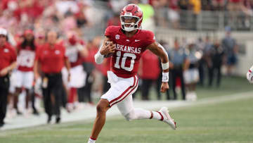 Aug 29, 2024; Little Rock, Arkansas, USA; Arkansas Razorbacks quarterback Taylor Green (10) rushes during the first quarter against the Pine Bluff Golden Lions at War Memorial Stadium. Mandatory Credit: Nelson Chenault-USA TODAY Sports