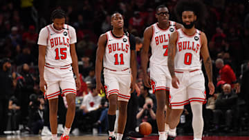 Feb 28, 2025; Chicago, Illinois, USA; (from left to right) Chicago Bulls forward Julian Phillips, guard Ayo Dosunmu, forward Jalen Smith, and guard Coby White are seen during a game against the Toronto Raptors at the United Center. Mandatory Credit: Patrick Gorski-Imagn Images