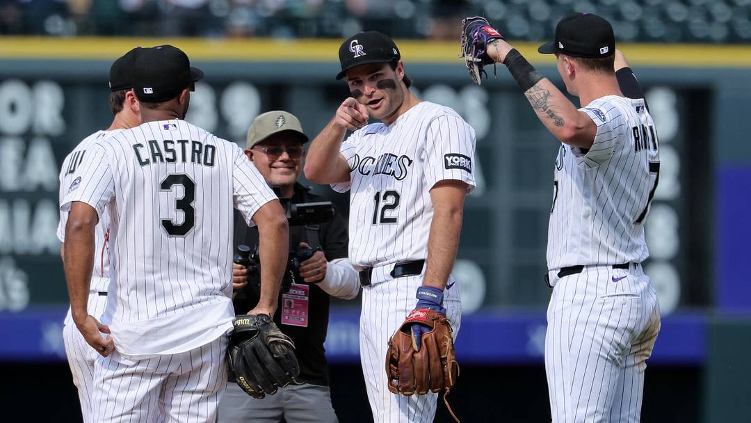 Colorado Rockies third baseman Kyle Karros (12) and shortstop Willi Castro (3) and first baseman TJ Rumfield (7) after the game. Colorado Rockies third baseman Kyle Karros (12) and shortstop Willi Castro (3) and first baseman TJ Rumfield (7) after the game.
