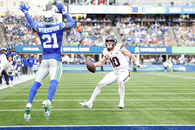 Denver Broncos quarterback Bo Nix (10) rushes for a touchdown against the Seattle Seahawks during the fourth quarter.