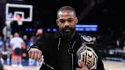 Nov 13, 2024; New York, New York, USA; UFC mixed martial arts heavyweight champion Jon Jones poses for a photo before a game between the New York Knicks and the Chicago Bulls at Madison Square Garden. Mandatory Credit: John Jones-Imagn Images