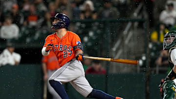 Sep 24, 2025; West Sacramento, California, USA; Houston Astros second baseman Jose Altuve (27) hits a fly ball against the Athletics in the sixth inning at Sutter Health Park. 