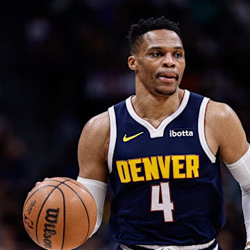 Mar 14, 2025; Denver, Colorado, USA; Denver Nuggets guard Russell Westbrook (4) controls the ball in the first quarter against the Los Angeles Lakers at Ball Arena. Mandatory Credit: Isaiah J. Downing-Imagn Images