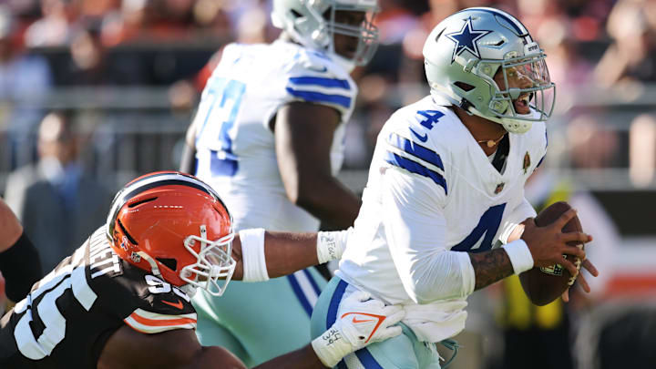 Sep 8, 2024; Cleveland, Ohio, USA; Dallas Cowboys quarterback Dak Prescott (4) is tackled by Cleveland Browns defensive end Myles Garrett (95) during the first half at Huntington Bank Field. Mandatory Credit: Ken Blaze-Imagn Images