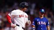 Boston Red Sox designated hitter Rafael Devers (11) hits a home run against the Texas Rangers in the seventh inning at Fenway Park on May 8.