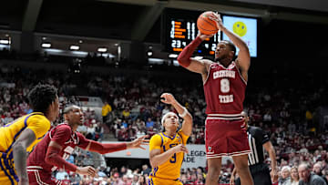 Jan 25, 2025; Tuscaloosa, AL, USA; Alabama guard Chris Youngblood (8) takes a three point shot over LSU forward Curtis Givens III (3) at Coleman Coliseum. Mandatory Credit: Gary Cosby Jr.-Tuscaloosa News