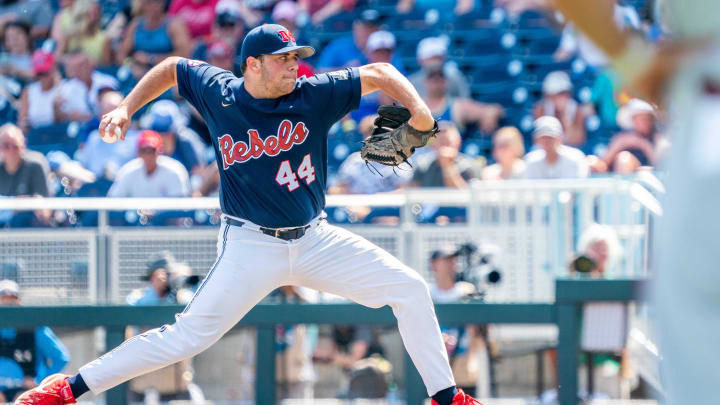 Jun 23, 2022; Omaha, NE, USA; Ole Miss Rebels starting pitcher Dylan DeLucia (44) pitches against the Arkansas Razorbacks during the fourth inning at Charles Schwab Field. Mandatory Credit: Dylan Widger-USA TODAY Sports