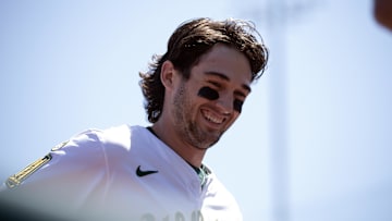 May 7, 2025; West Sacramento, California, USA; Athletics shortstop Jacob Wilson (5) is all smiles as he returns to the dugout to retrieve his glove during the fourth inning against the Seattle Mariners at Sutter Health Park. Mandatory Credit: D. Ross Cameron-Imagn Images