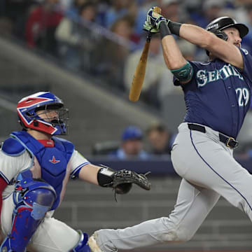 Oct 20, 2025; Toronto, Ontario, CAN; Seattle Mariners catcher Cal Raleigh (29) hits a solo home run against the Toronto Blue Jays in the fifth inning during game seven of the ALCS round for the 2025 MLB playoffs at Rogers Centre. Mandatory Credit: John E. Sokolowski-Imagn Images