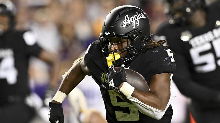 Oct 26, 2024; College Station, Texas, USA; Texas A&M Aggies running back Amari Daniels (5) runs the ball against the LSU Tigers during the fourth quarter. The Aggies defeated the Tigers 38-23; at Kyle Field. Mandatory Credit: Maria Lysaker-Imagn Images.  