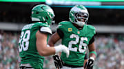 Oct 26, 2025; Philadelphia, Pennsylvania, USA; Philadelphia Eagles tight end Dallas Goedert (88) celebrates scoring a touchdown with running back Saquon Barkley (26) in the second quarter against the New York Giants at Lincoln Financial Field. Mandatory Credit: Bill Streicher-Imagn Images