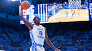 Nov 18, 2025; Chapel Hill, North Carolina, USA; North Carolina Tar Heels forward Caleb Wilson (8) goes up for a dunk against the Navy Midshipmen during the second half at Dean E. Smith Center. 