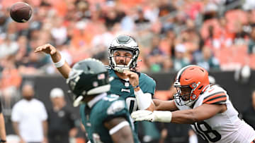 Aug 21, 2022; Cleveland, Ohio, USA; Philadelphia Eagles quarterback Gardner Minshew (10) throws a pass as Cleveland Browns defensive end Isaac Rochell (98) defends during the first half at FirstEnergy Stadium. Mandatory Credit: Ken Blaze-Imagn Images
