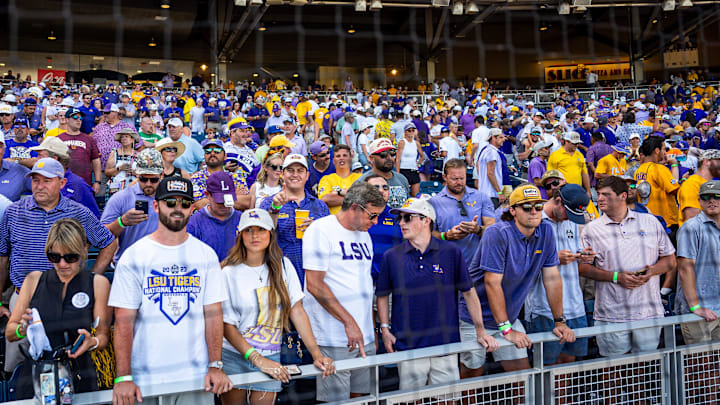 LSU Tigers celebrate during awards after winning the College World Series at Charles Schwab Field. LSU Tigers celebrate during awards after winning the College World Series at Charles Schwab Field.