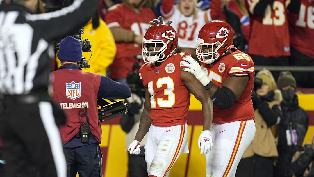 Jan 23, 2022; Kansas City, Missouri, USA; Kansas City Chiefs wide receiver Byron Pringle (13) celebrates his touchdown with Kansas City Chiefs guard Trey Smith (65) during the first half in the AFC Divisional playoff football game against the Buffalo Bills at GEHA Field at Arrowhead Stadium. Mandatory Credit: Jay Biggerstaff-Imagn Images