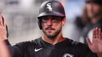 Chicago White Sox right fielder Mike Tauchman (18) celebrates with teammates after scoring against the Atlanta Braves at Truist Park. 