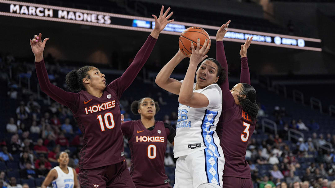 Mar 6, 2026; Duluth, GA, USA; North Carolina Tar Heels guard Taissa Queiroz (26) controls a rebound against Virginia Tech Hokies forward Carys Baker (10) at Gas South Arena. Mandatory Credit: Dale Zanine-Imagn Images Mar 6, 2026; Duluth, GA, USA; North Carolina Tar Heels guard Taissa Queiroz (26) controls a rebound against Virginia Tech Hokies forward Carys Baker (10) at Gas South Arena. Mandatory Credit: Dale Zanine-Imagn Images