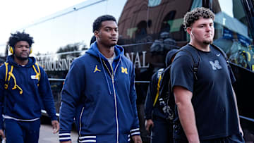 Michigan defensive back Will Johnson (2), center, and defensive lineman Mason Graham (55) walk towards locker room as the team arrive before the Michigan State game at Michigan Stadium in Ann Arbor on Saturday, Oct. 26, 2024.