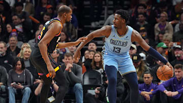 Feb 11, 2025; Phoenix, Arizona, USA; Phoenix Suns forward Kevin Durant (35) guards Memphis Grizzlies forward Jaren Jackson Jr. (13) during the first half at Footprint Center. Mandatory Credit: Joe Camporeale-Imagn Images