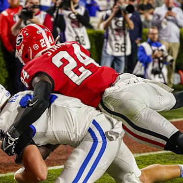 Oct 7, 2023; Athens, Georgia, USA; Kentucky Wildcats tight end Josh Kattus (84) catches a touchdown pass against Georgia Bulldogs defensive back Malaki Starks (24) during the first half at Sanford Stadium. Mandatory Credit: Dale Zanine-Imagn Images