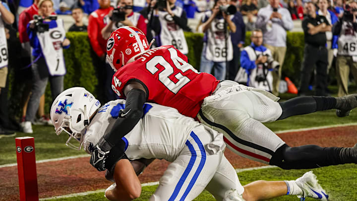 Oct 7, 2023; Athens, Georgia, USA; Kentucky Wildcats tight end Josh Kattus (84) catches a touchdown pass against Georgia Bulldogs defensive back Malaki Starks (24) during the first half at Sanford Stadium. Mandatory Credit: Dale Zanine-Imagn Images