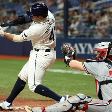 Sep 3, 2024; St. Petersburg, Florida, USA; Tampa Bay Rays catcher Logan Driscoll (41) hits an RBI single for his first career MLB hit during the third inning against the Minnesota Twins at Tropicana Field.