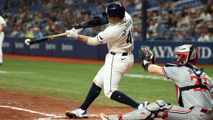 Sep 3, 2024; St. Petersburg, Florida, USA; Tampa Bay Rays catcher Logan Driscoll (41) hits an RBI single for his first career MLB hit during the third inning against the Minnesota Twins at Tropicana Field.