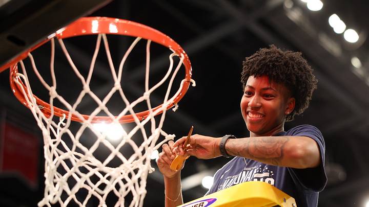 Apr 6, 2025; Tampa, FL, USA; Connecticut Huskies forward Ayanna Patterson (34) cuts down the net after the national championship of the women's 2025 NCAA tournament against the South Carolina Gamecocks at Amalie Arena. Mandatory Credit: Nathan Ray Seebeck-Imagn Images