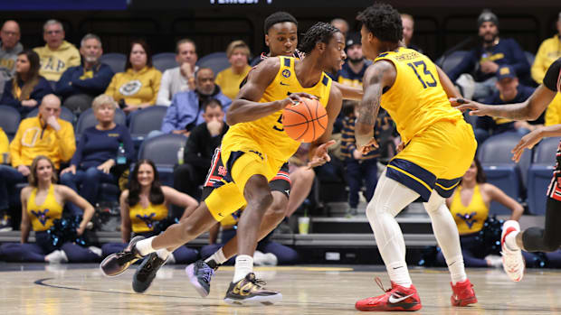 West Virginia University guard Toby Okani