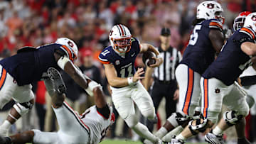 Oct 11, 2025; Auburn, Alabama, USA;  Auburn Tigers quarterback Jackson Arnold (11) carries during the second quarter against the Georgia Bulldogs at Jordan-Hare Stadium. Mandatory Credit: John Reed-Imagn Images
