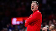 Arizona Wildcats head coach Tommy Lloyd yells toward his team on the sidelines during the first half against the BYU Cougars at McKale Center.