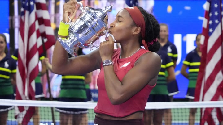 Sep 9, 2023; Flushing, NY, USA; Coco Gauff of the United States celebrates with the championship trophy after her match against Aryna Sabalenka (not pictured) in the women's singles final on day thirteen of the 2023 U.S. Open tennis tournament at USTA Billie Jean King Tennis Center. 