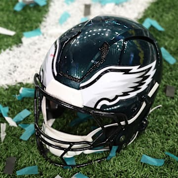 Feb 9, 2025; New Orleans, LA, USA; A Philadelphia Eagles player's helmet rests on the field after Super Bowl LIX against the Kansas City Chiefs at Caesars Superdome. Mandatory Credit: Geoff Burke-Imagn Images