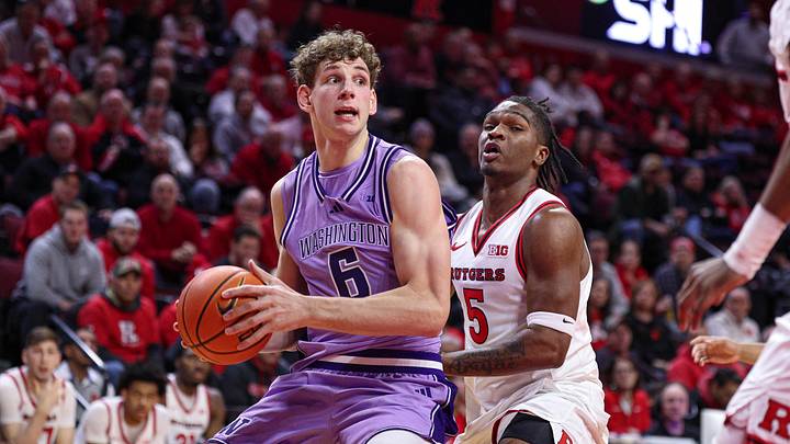 Feb 24, 2026; Piscataway, New Jersey, USA; Washington Huskies forward Hannes Steinbach (6) looks to the basket as Rutgers Scarlet Knights guard Darren Buchanan Jr. (5) defends during the first half at Jersey Mike's Arena. Mandatory Credit: Vincent Carchietta-Imagn Images