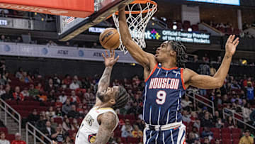 Mar 17, 2023; Houston, Texas, USA; New Orleans Pelicans forward Naji Marshall (8) scores against Houston Rockets guard Josh Christopher (9) in the second quarter at Toyota Center. Mandatory Credit: Thomas Shea-Imagn Images