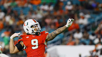 Sep 7, 2024; Miami Gardens, Florida, USA; Miami Hurricanes defensive lineman Tyler Baron (9) celebrates after sacking Florida A&M Rattlers quarterback Daniel Richardson (not pictured) during the third quarter at Hard Rock Stadium. Mandatory Credit: Sam Navarro-Imagn Images