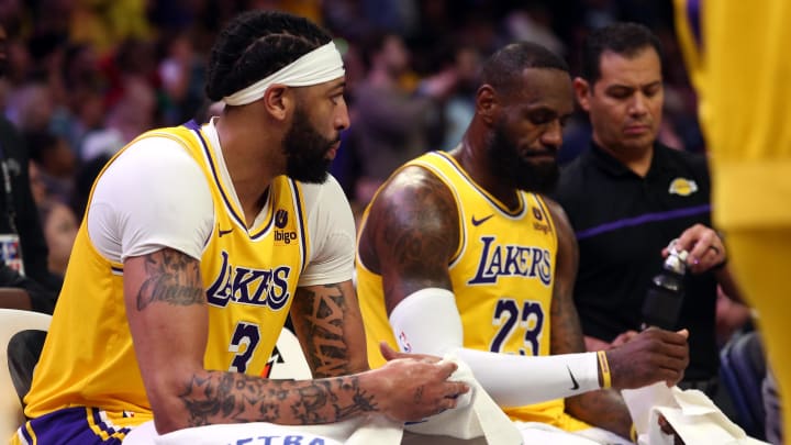 Apr 12, 2024; Memphis, Tennessee, USA; Los Angeles Lakers forward Anthony Davis (3) and forward LeBron James (23) sit on the bench during a time out during the second half against the Memphis Grizzlies at FedExForum. Mandatory Credit: Petre Thomas-USA TODAY Sports