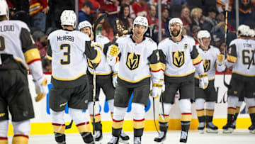 Vegas Golden Knights defenseman Noah Hanifin and teammates celebrate their 3-2 overtime win over the Calgary Flames.