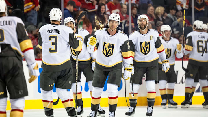 Vegas Golden Knights defenseman Noah Hanifin and teammates celebrate their 3-2 overtime win over the Calgary Flames.