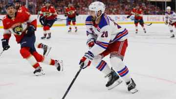 May 28, 2024; Sunrise, Florida, USA; New York Rangers left wing Chris Kreider (20) moves the puck against the Florida Panthers during the third period in game four of the Eastern Conference Final of the 2024 Stanley Cup Playoffs at Amerant Bank Arena. Mandatory Credit: Sam Navarro-USA TODAY Sports