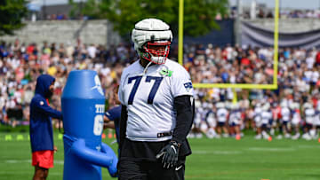 Jul 27, 2023; Foxborough, MA, USA; New England Patriots offensive tackle Trent Brown (77) waits to start a drill during training camp at Gillette Stadium. Mandatory Credit: Eric Canha-Imagn Images
