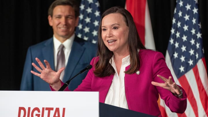 Florida Attorney General Ashley Moody speaks in front of Florida Gov. Ron DeSantis during a press conference at Palm Beach Atlantic University in February 2023.