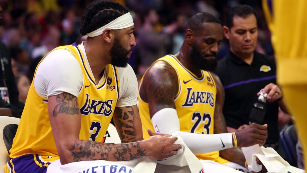 Apr 12, 2024; Memphis, Tennessee, USA; Los Angeles Lakers forward Anthony Davis (3) and forward LeBron James (23) sit on the bench during a timeout during the second half against the Memphis Grizzlies at FedExForum. Mandatory Credit: Petre Thomas-USA TODAY Sports