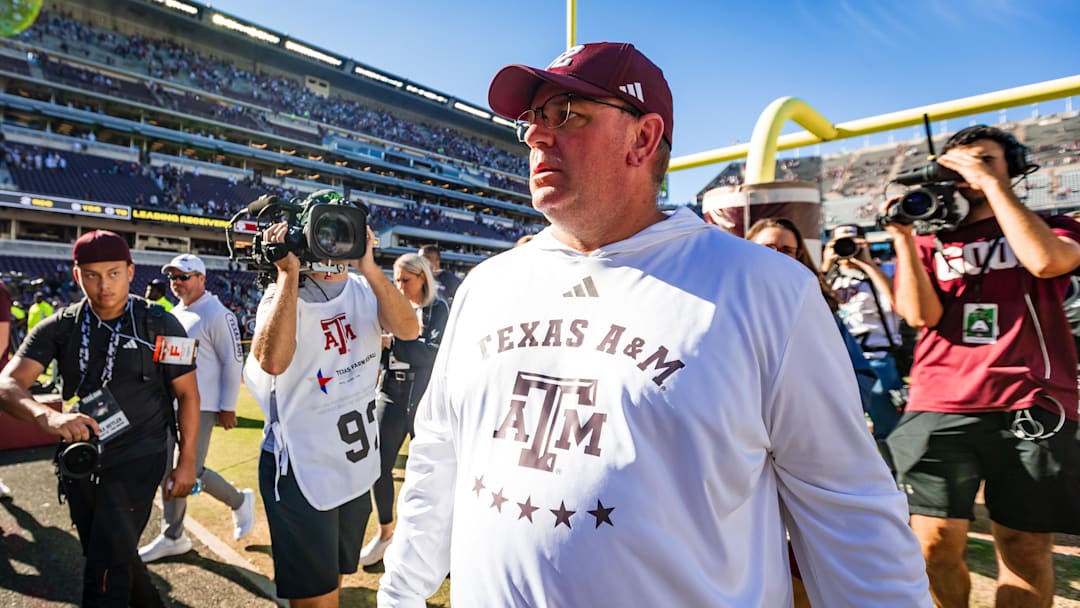 Nov 22, 2025; College Station, Texas, USA; Texas A&M Aggies head coach Mike Elko walks off the field after defeating the Samford Bulldogs 48-0 in a game at Kyle Field. Mandatory Credit: Joseph Buvid-Imagn Images Nov 22, 2025; College Station, Texas, USA; Texas A&M Aggies head coach Mike Elko walks off the field after defeating the Samford Bulldogs 48-0 in a game at Kyle Field. Mandatory Credit: Joseph Buvid-Imagn Images